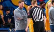Zach Spiker, the head coach of the Drexel Dragons, speaks to the referee during an NCAA me...