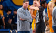 Zach Spiker, the head coach of the Drexel Dragons, speaks to the referee during an NCAA me...