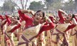 Assamese girls dress in traditional mekhela and perform the traditional Bihu dance during...