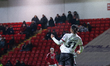 Akin Odimayo of Crawley Town heads the ball away during the Sky Bet League 2 match between...