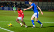 Kelly Nmai of Salford City FC is under pressure from Dylan Duffy of Chesterfield FC during...