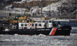 The US Coast Guard navigates through ice on the Hudson River in New York, United States, o...