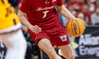 Andrew Rohde #7 of the Wisconsin Badgers drives the lane against the Minnesota Golden Goph...