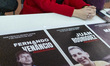 Posters of Portuguese-Venezuelan political prisoners are displayed during a meeting betwee...
