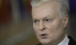Lithuania's President Gitanas Nauseda talks to the press as he arrives for the special Eur...