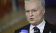 Lithuania's President Gitanas Nauseda talks to the press as he arrives for the special Eur...