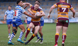 Ben Crooks is stopped by the Halifax defense during the BETFRED Championship match between...