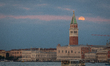 Full Snow Moon setting next to Saint Mark Bell Tower is seen in Venice, Italy, on February...
