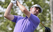 Cameron Adam of Scotland tees off on the 6th hole during the second round of the Qatar Mas...