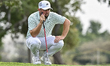 Alex Fitzpatrick of England lines up on the 2nd green during the second round of the Qatar...