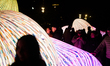 People visit a light installation on the first day of the Llum BCN festival in Barcelona,...