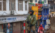 An Indian security personnel stands alert during a random security check in Srinagar, Jamm...