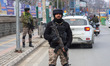 An Indian security personnel stands alert during a random security check in Srinagar, Jamm...