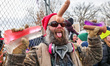 A man demonstrates with a sex toy on his head outside the Bishop Henry Whipple Federal Bui...