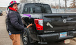 Sex toys are stuck on a vehicle driven by federal agents as people demonstrate outside the...