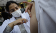 Medical personnel in Mexico City, Mexico, on February 11, 2026, administer measles vaccine...