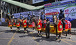Mounted police patrols maintain security outside the polling center during Bangladesh's ge...