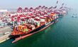 A cargo ship loads and unloads foreign trade containers at Qingdao Port in Qingdao City, S...