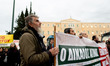 Farmers park their tractors in front of the Greek parliament as they protest against high...