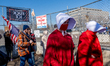 Demonstrators protest at the Bishop Whipple Federal Building that houses ICE detainees in...