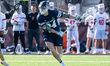 Matthew Kephart, 34, of the Princeton Tigers possesses the ball during an NCAA men's lacro...