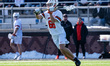 Cooper Mueller, 66, of the Princeton Tigers looks to pass during an NCAA men's lacrosse ga...