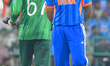 Suryakumar Yadav of India and Salman Agha of Pakistan participate in the toss during the I...