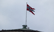 The Norwegian flag flies above the Storting in Oslo, Norway, on February 11, 2026. 