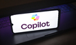 The Microsoft Copilot logo appears on a smartphone screen in this photo illustration in On...