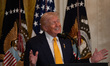 US President Donald Trump speaks in the East Room of the White House at a Black History Mo...