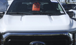 A red tag sale sign hangs in the window of a Ford truck for sale in Hawthorne, California,...