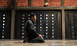 Muslims pray on the first day of Ramadan's fasting month at the Foundation of Islamic Cent...