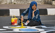 Bangladeshi fine arts students paint on the street in front of the Shahid Minar, a languag...