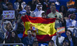 Fans of Carlos Alcaraz of Spain hold up a Spanish flag in support during his men's singles...