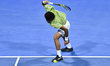 Arthur Fils of France reacts by smashing his racket during the men's singles final against...