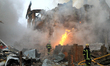 Firefighters extinguish a blaze caused by a Russian attack in a residential area of Sofiiv...
