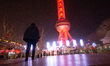 The Shanghai Pearl TV Tower lights up red during the Chinese Lunar New Year holiday at Luj...