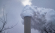 Pollution and steam rise from the stacks of the Miami Fort Power Station, which is situate...