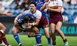 Jacob Gagai tackles Max Jowitt during the BetFred Super League match between Huddersfield...