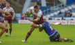 Sam Hewitt is tackled during the BetFred Super League match between Huddersfield Giants an...