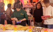 Hindus and Sikhs shop for traditional Indian sweets during the Mithai Mela (Indian sweets...
