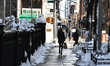 A woman walks down the clean sidewalk on E. 29th Street in New York, United States, on Feb...