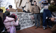 Columbia students and staff, activists, and supporters protest outside the main campus gat...
