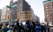 Columbia students and staff, activists, and supporters protest outside the main campus gat...