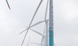 Wind turbines stand tall on the windmill coast of Mulan Bay in Wenchang City, Hainan Provi...