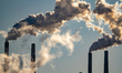 Pollution and steam rise from the stacks of the Miami Fort Power Station, which is situate...