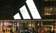 WARSAW, POLAND - FEBRUARY 26: A large, illuminated Adidas three-stripe logo dominates the...