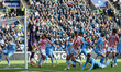 Action in the goal area as Ben Gibson of Stoke City turns in the corner by Sorba Thomas of...