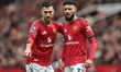 Diogo Dalot of Manchester United speaks to Noussair Mazraoui of Manchester United during t...