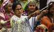 Mamata Banerjee participates in a Dandiya dance performance as part of pre-Holi celebratio...